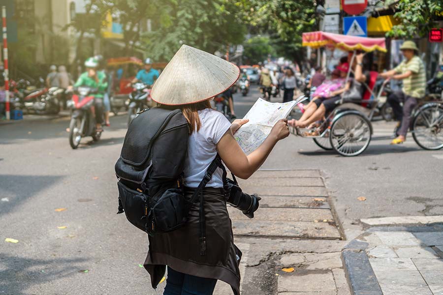 tourist navigating map in vietnam