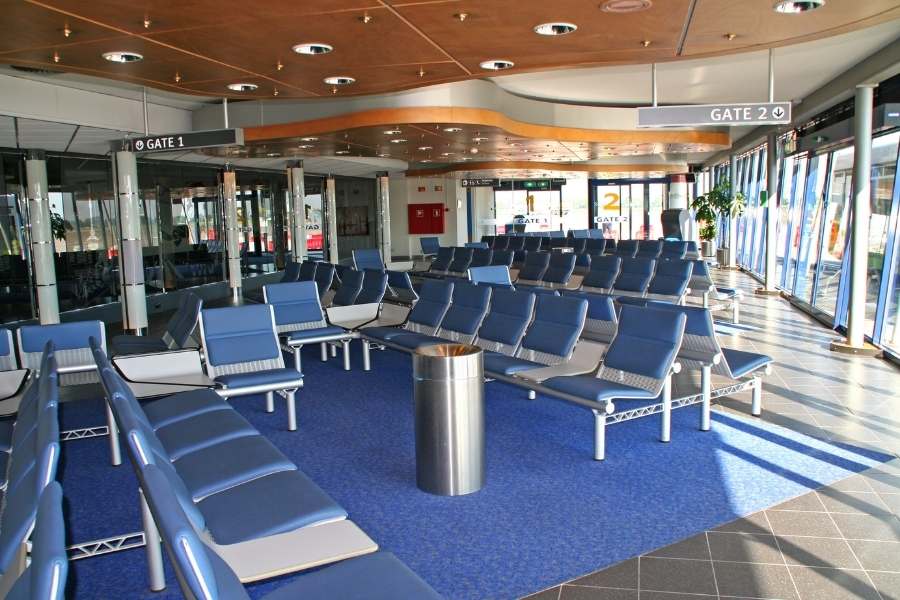 7 Airport Hacks - How To Save Money And Start Your Trip Right - Quiet airport gate